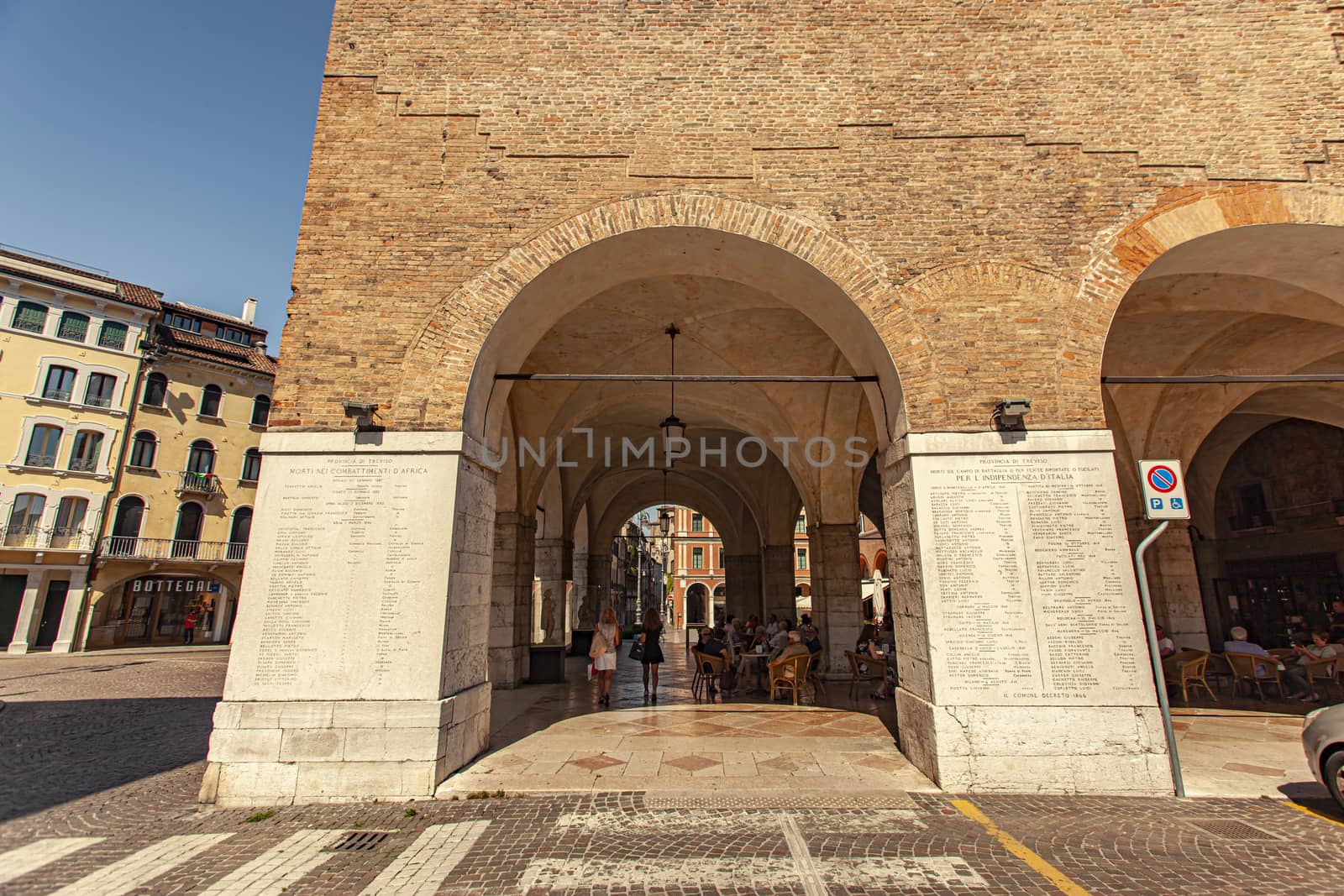 TREVISO, ITALY 13 AUGUST 2020: Historical buildings with arcades in Treviso city center in Italy