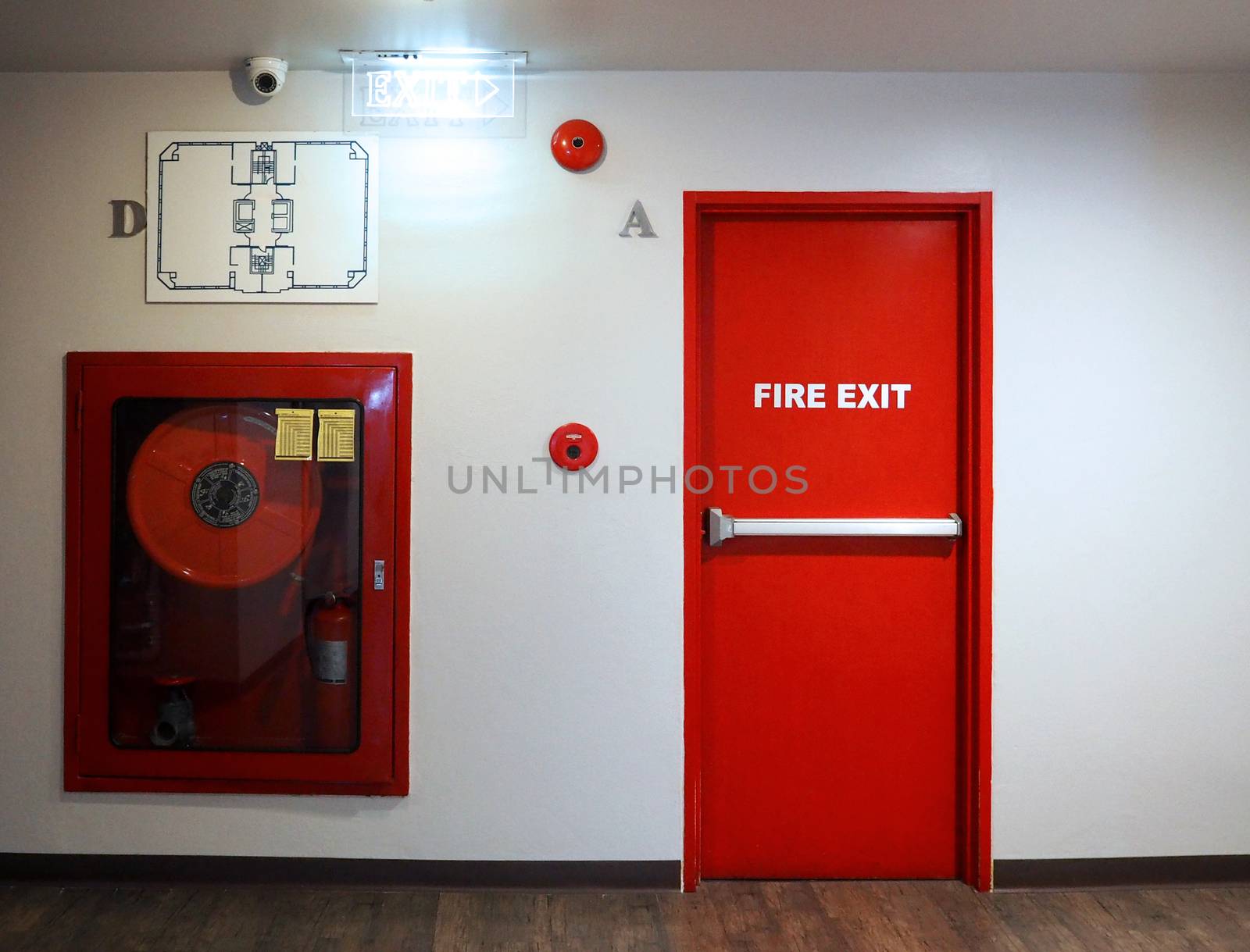 Fire exit emergency door red color metal material. by gnepphoto