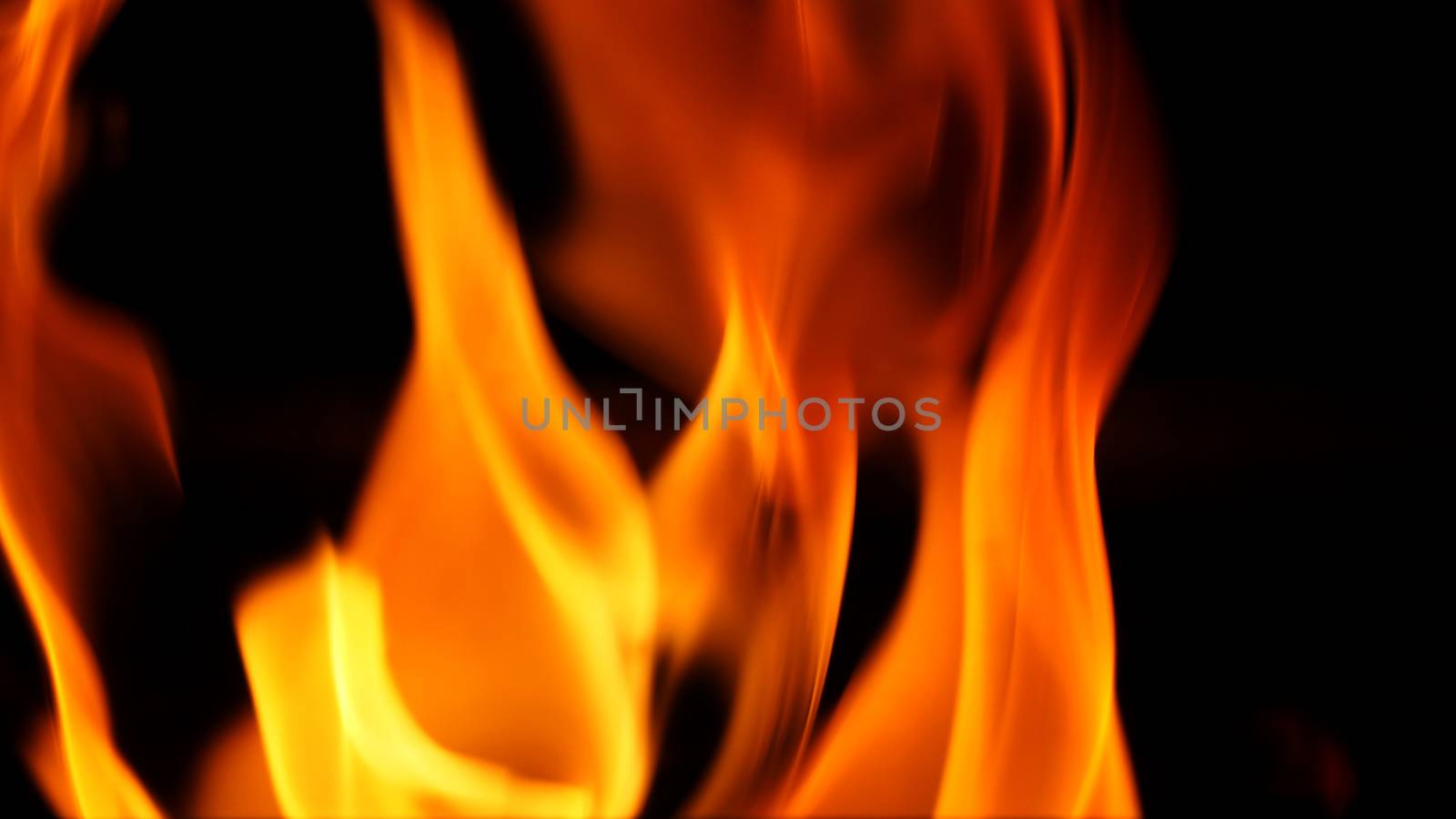 Abstract flame on black background by gnepphoto