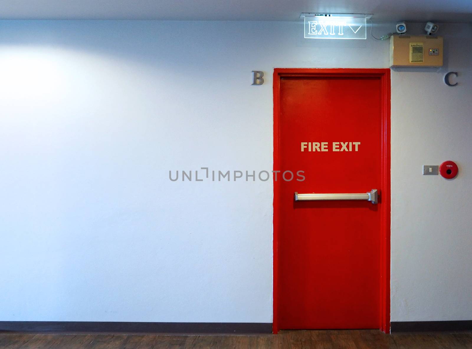 Fire exit emergency door red color metal material. by gnepphoto