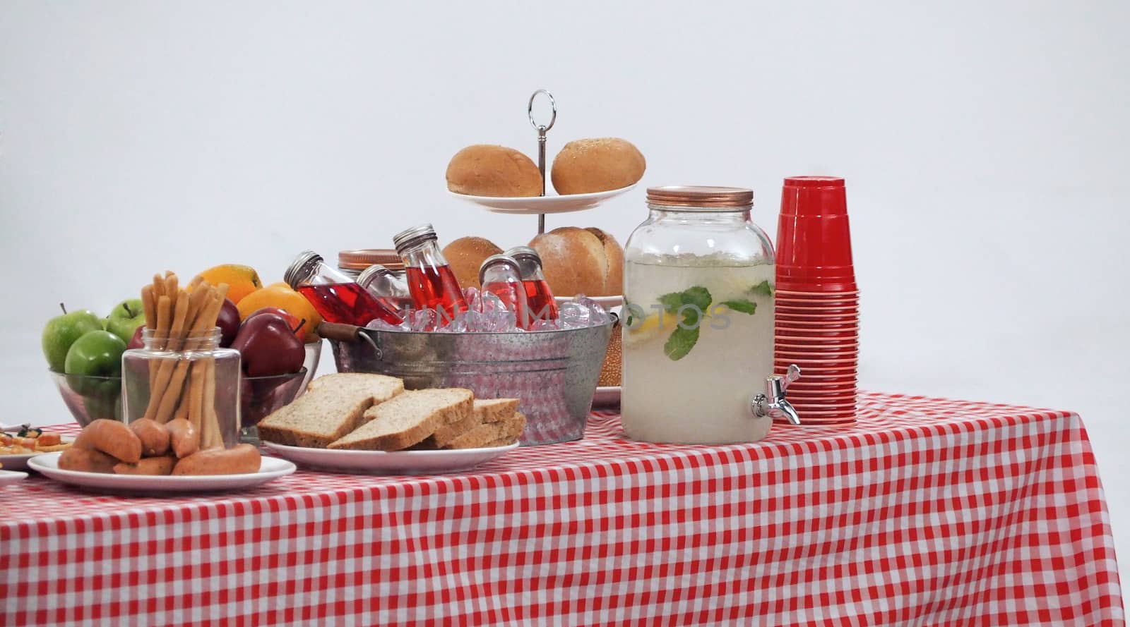 Wood table and red napkin cover for outdoor party by gnepphoto