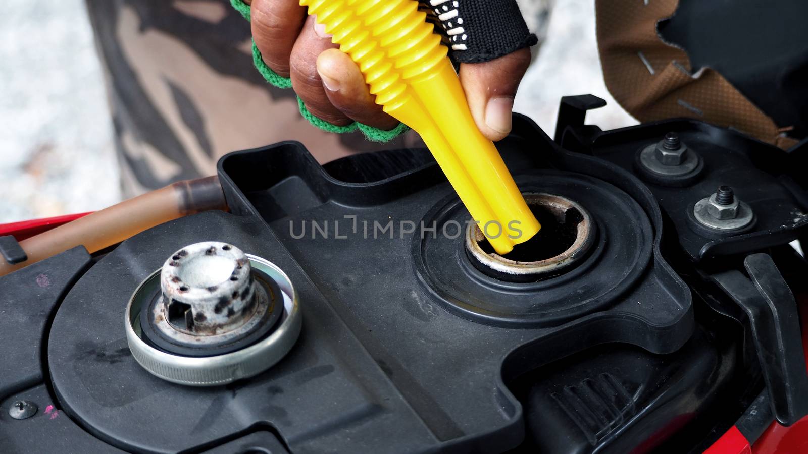 Fuel tank of motorcycle that opened and waiting for oil or gasoline and high angle view.