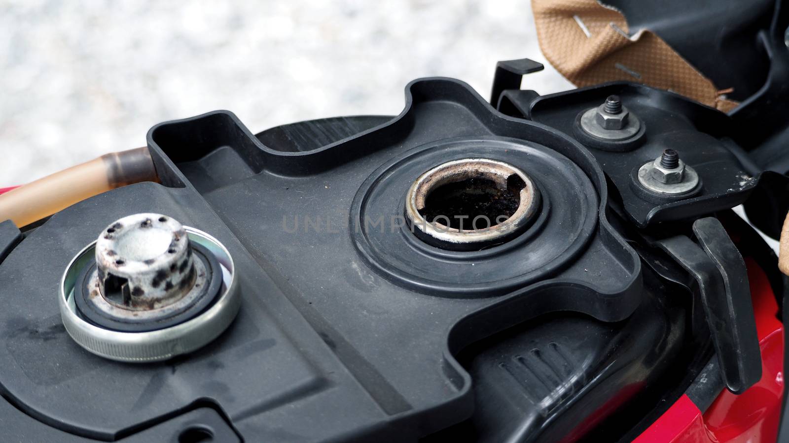 Fuel tank of motorcycle that opened and waiting for oil or gasoline and high angle view.