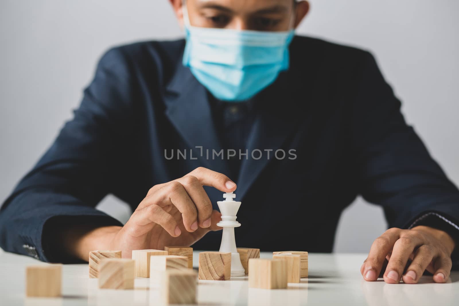 Hands of entrepreneur business man holding wooden blocks placing by golfmhee