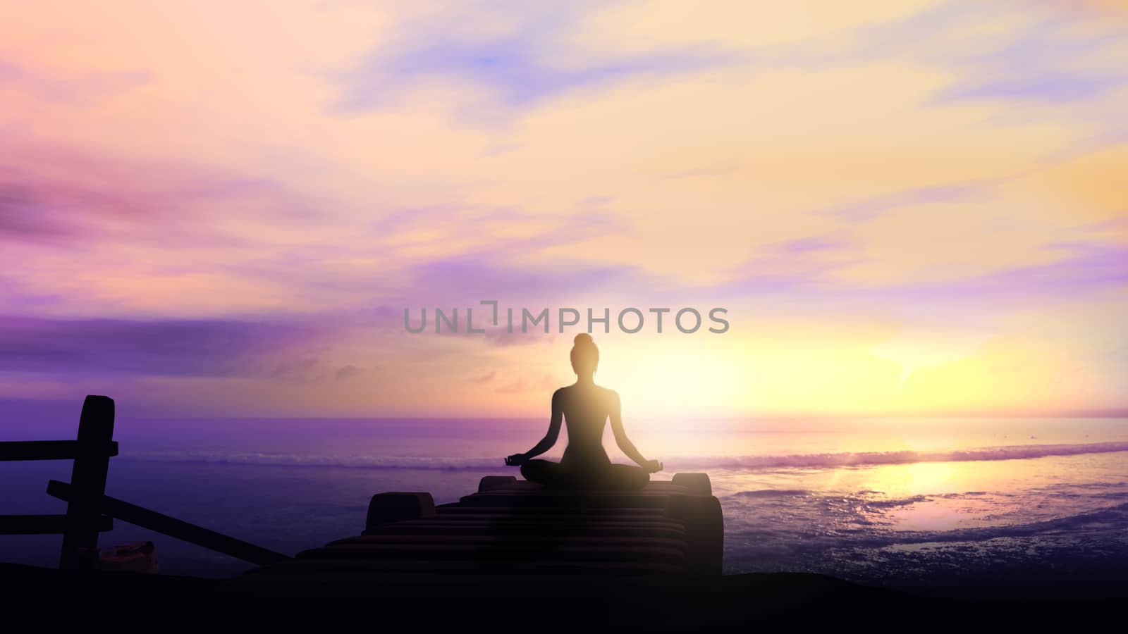 Female silhouette while meditating on the background of the ocean.