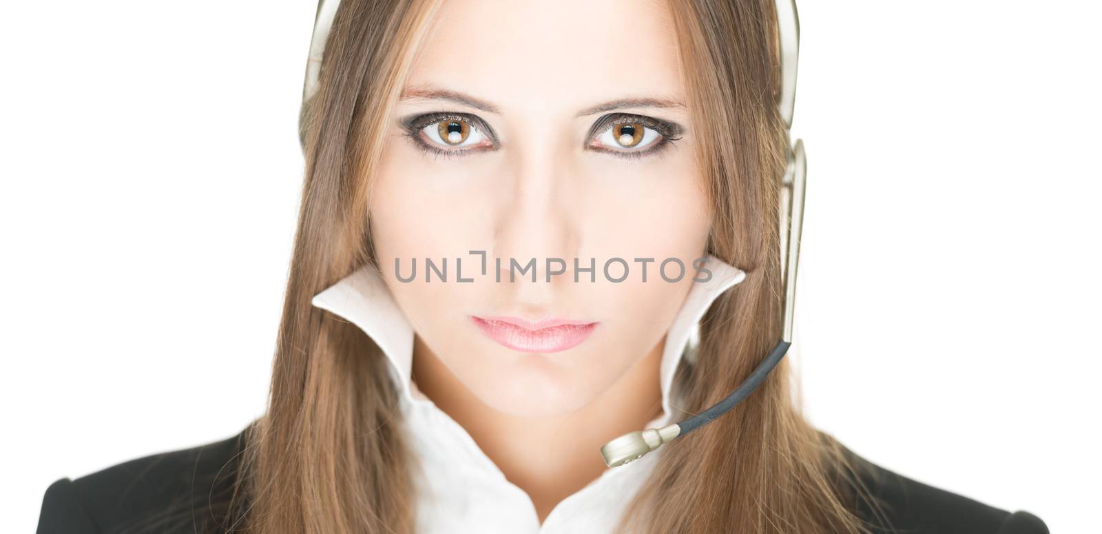 Portrait of customer service and call centre operator woman isolated on white background. Serious and sexy girl with in office clothes and headset being concentrated. Hotline, help and support.