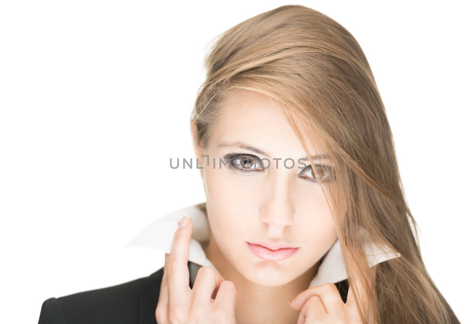 Portrait of stylish beautiful girl with long hair and bright make-up isolated on white background. Young business woman in black jacket and white blouse with raised collar looking serious and sexy.