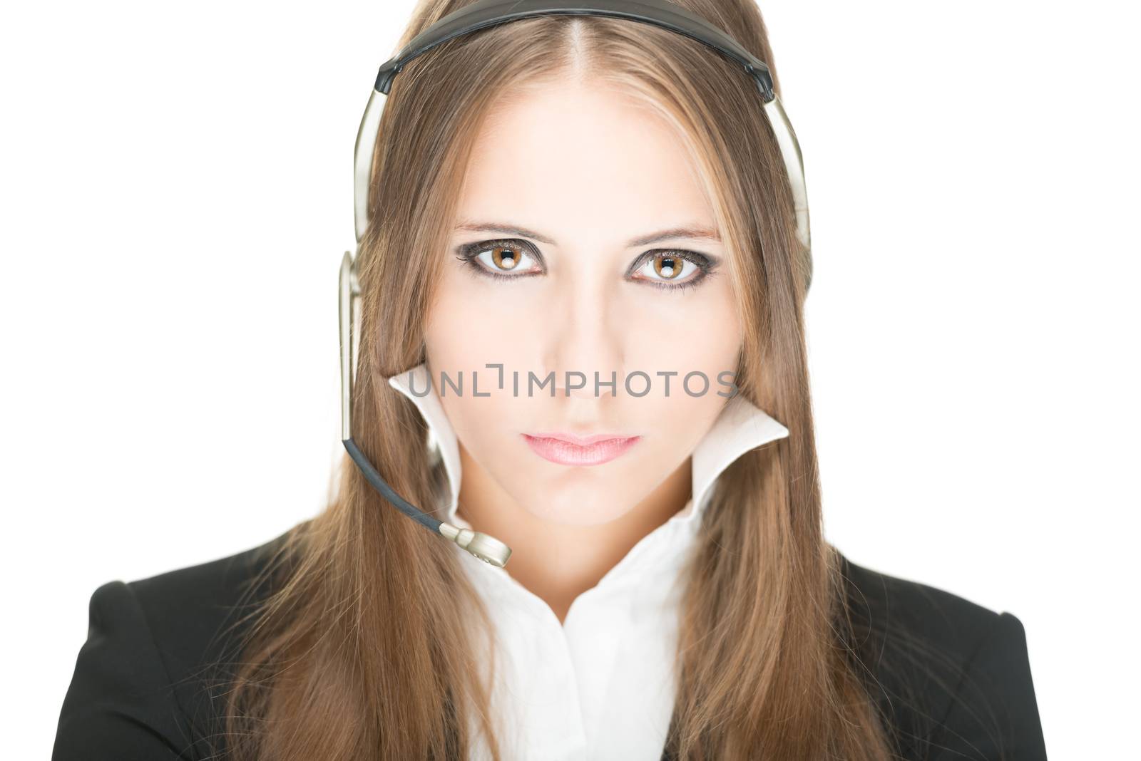 Portrait of customer service and call centre operator woman isolated on white background. Serious and sexy girl with in office clothes and headset being concentrated. Hotline, help and support.