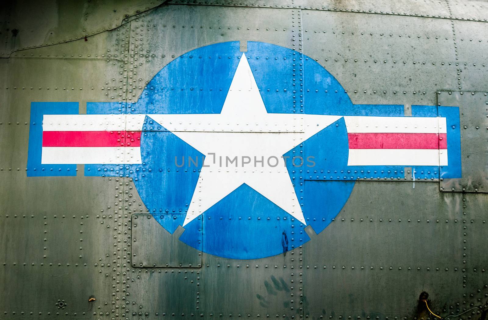 Military plane with star and stripe sign. by Yolshin
