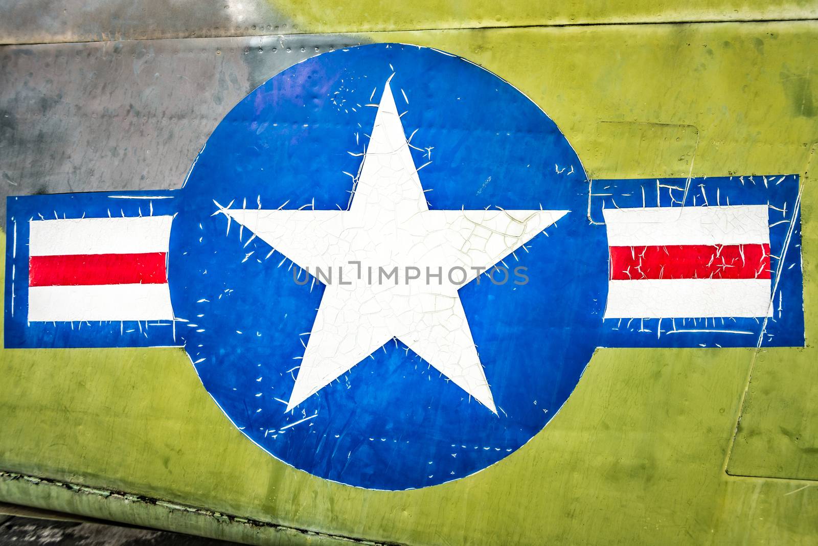 Part of military airplane with United States Air Force sign. Big white star in blue circle with stripes aside. War aircraft in metal plates. Military aviation. Retro style. Safety and protection.