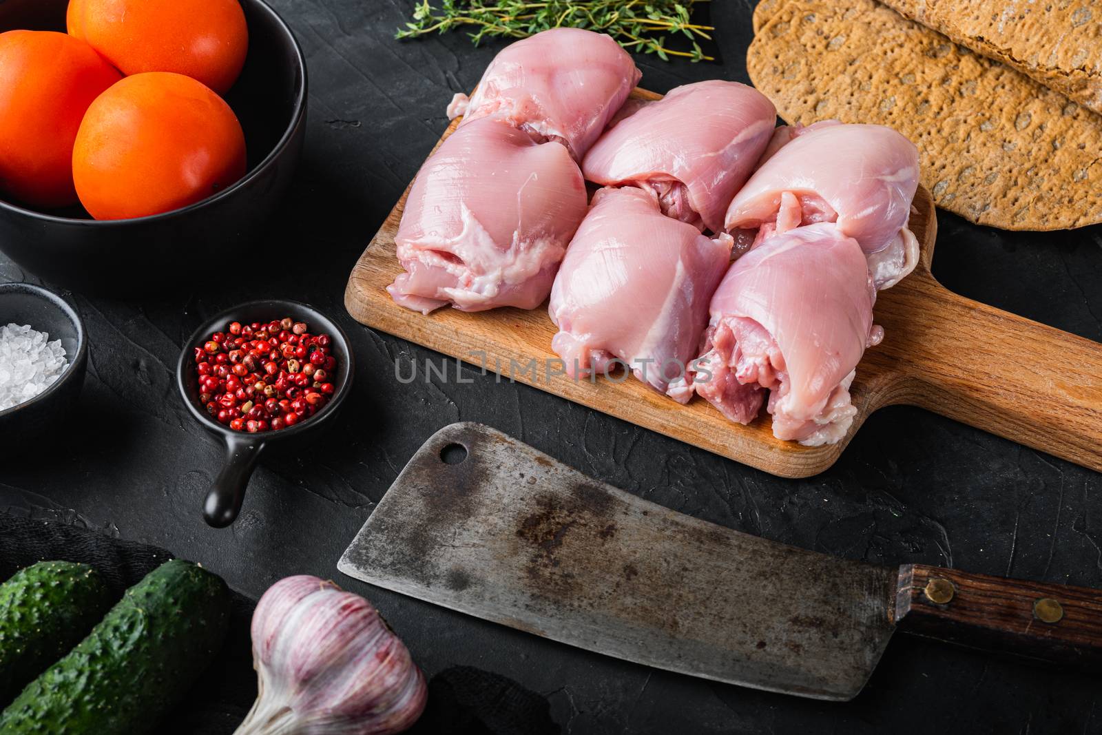 Doner ingredients, chicken meat on black background.