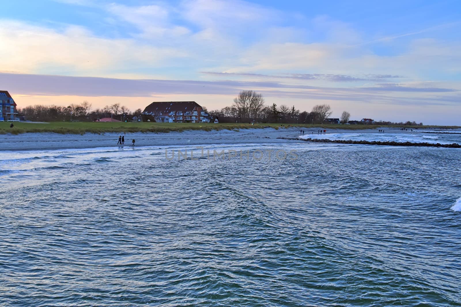 Beach life with some people in the distance in Schoenberg in northern Germany