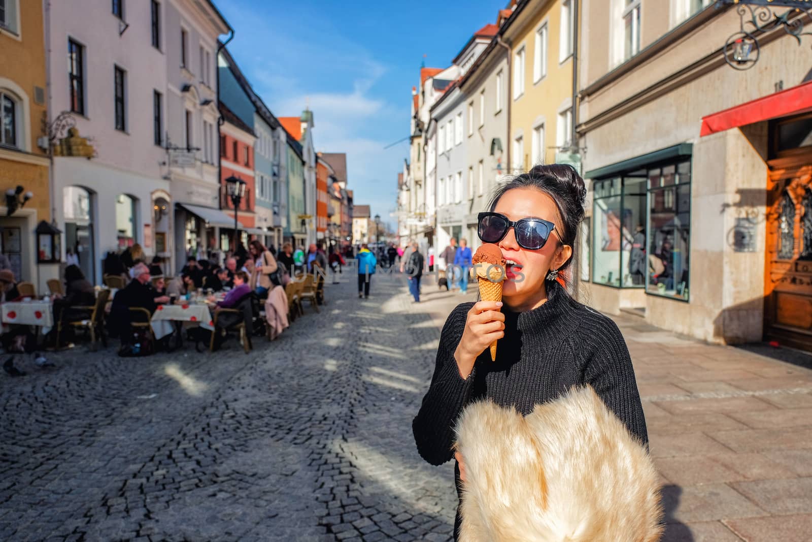 Young Woman having fun and enjoy to eating ice cream in Fussen,Germany