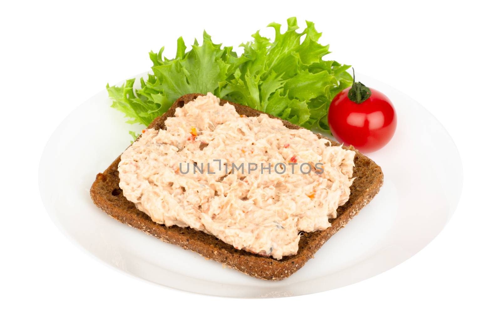 Smoked salmon and soft cheese spread fish pate sandwich on plate isolated on white background