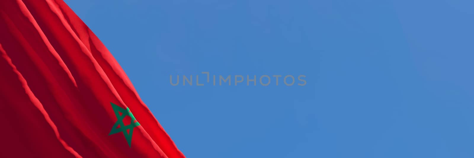 3D rendering of the national flag of Morocco waving in the wind against a blue sky