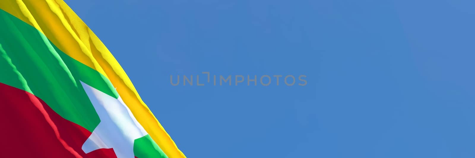 3D rendering of the national flag of Myanmar waving in the wind against a blue sky