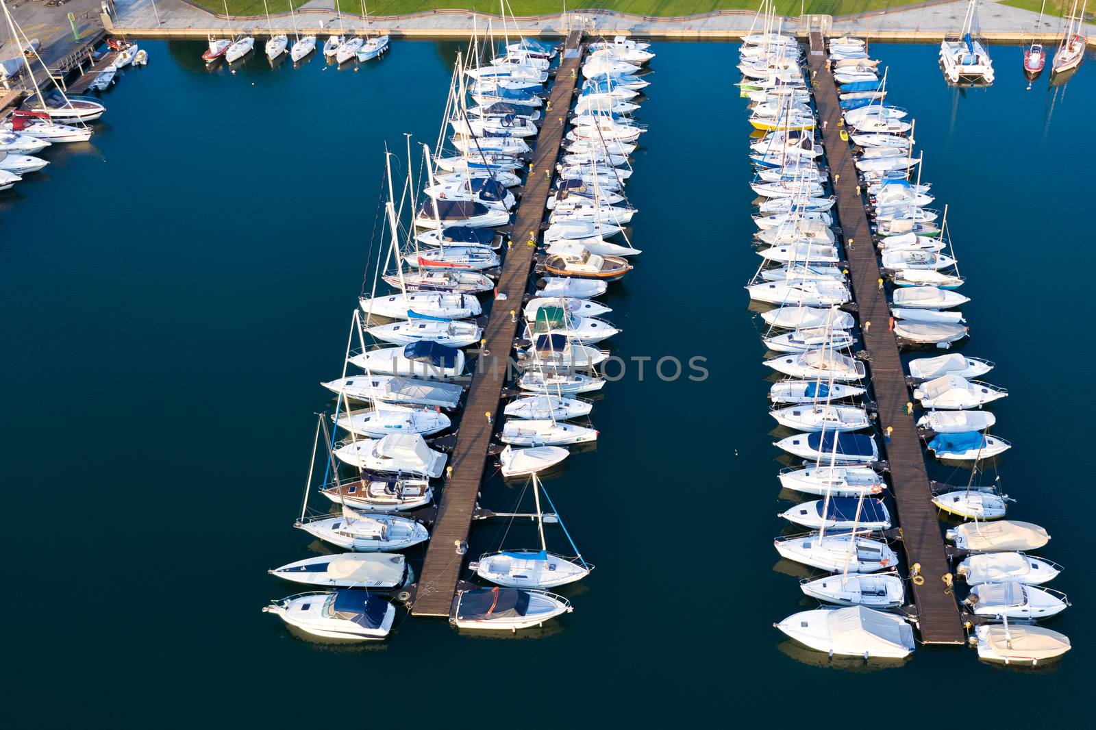 Aerial bird eye view of sailboats and yachts moored in Lovere port, Iseo lake near Bergamo,Italy.