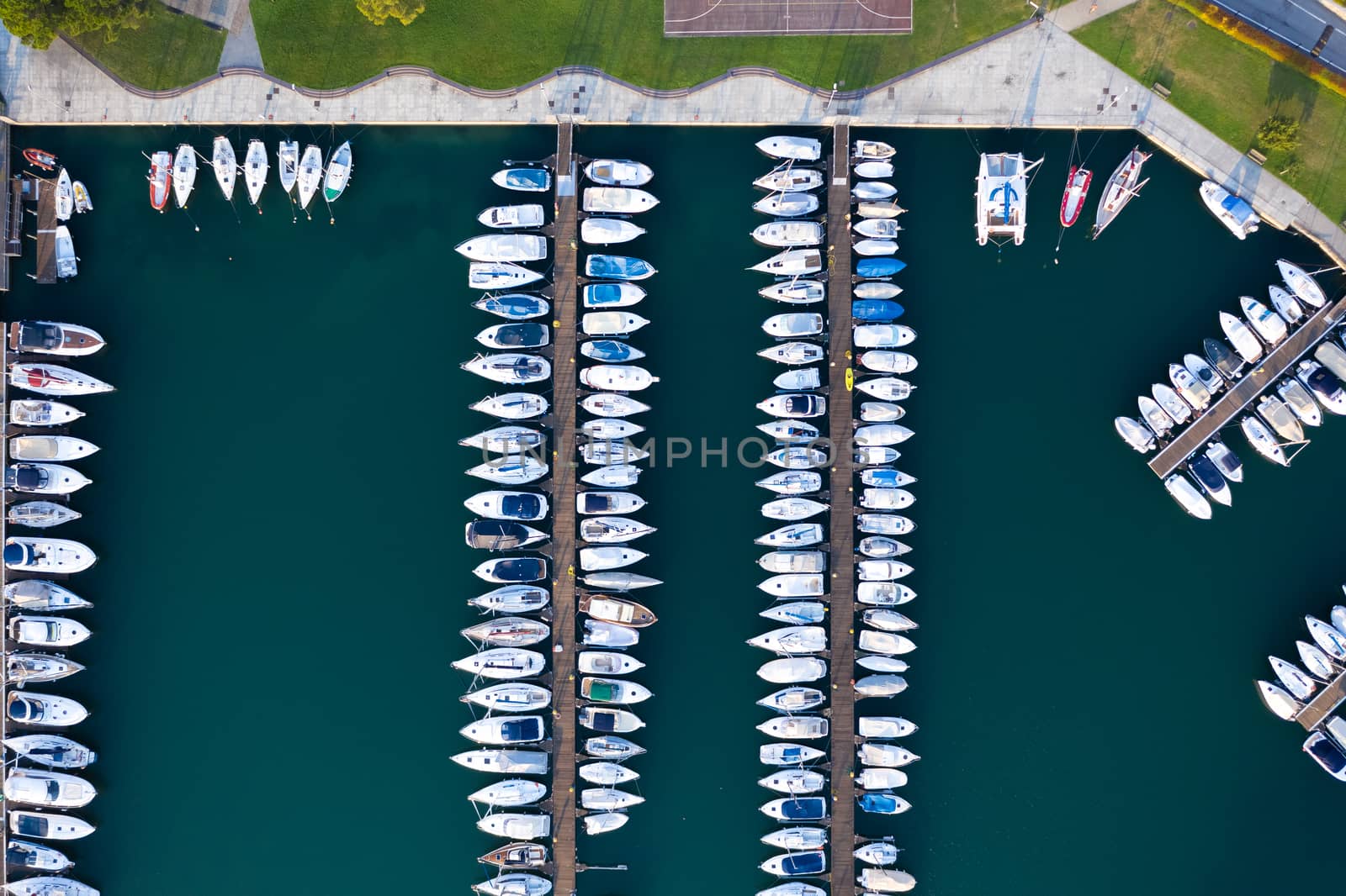 Aerial bird eye view of sailboats and yachts moored in Lovere port, Iseo lake near Bergamo,Italy.