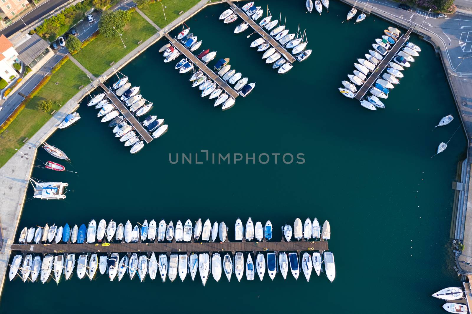 Aerial bird eye view of sailboats and yachts moored in Lovere port, Iseo lake near Bergamo,Italy.