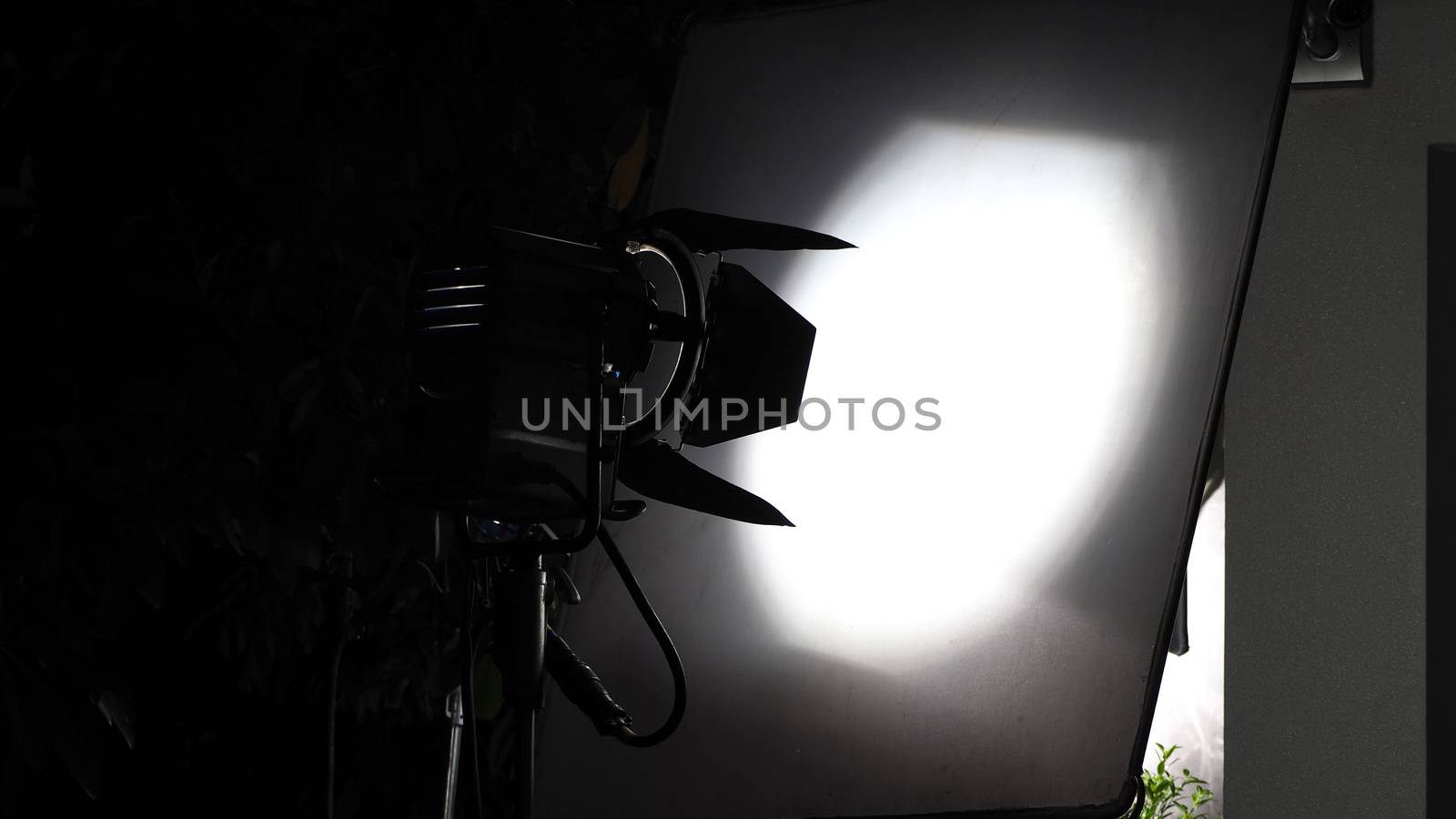 Big studio lighting with tripod for video production. by gnepphoto