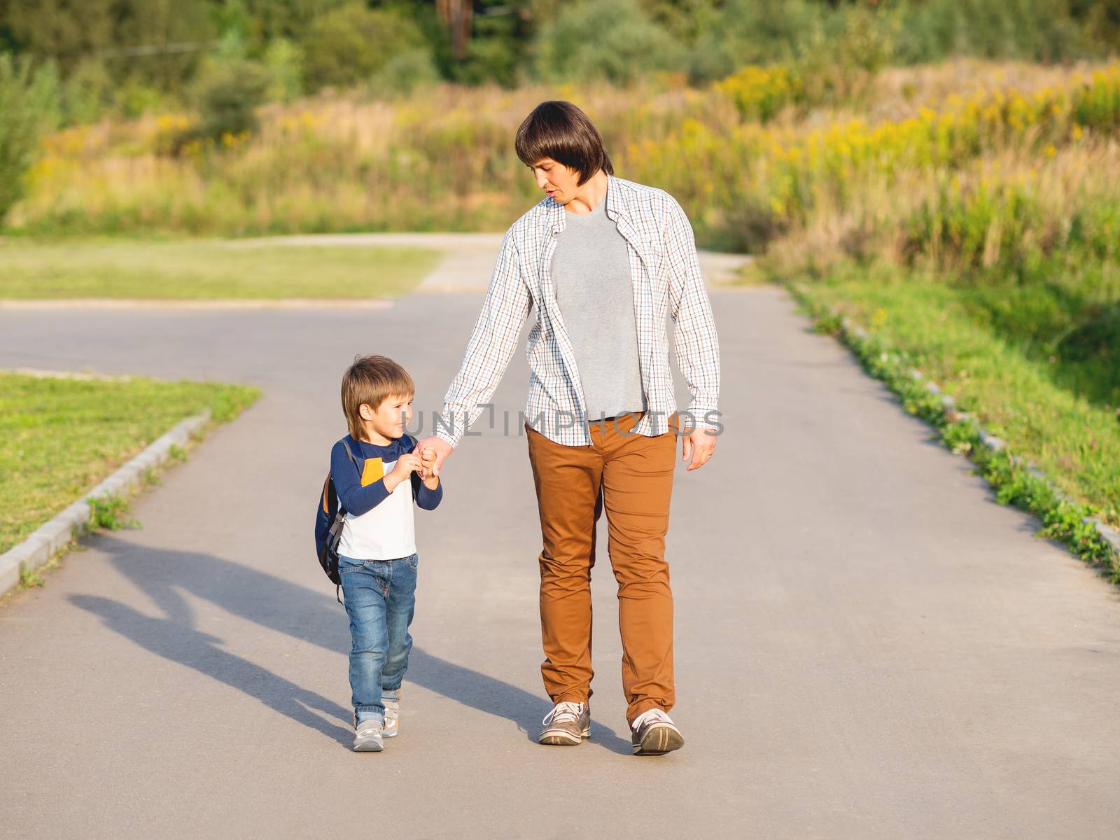 Father takes his son to school. Back to school after summer holi by aksenovko