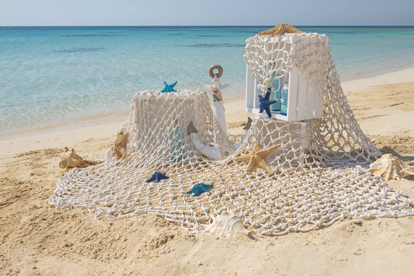 Closeup of wedding romantic decorations on tropical island sandy beach paradise with ocean in background