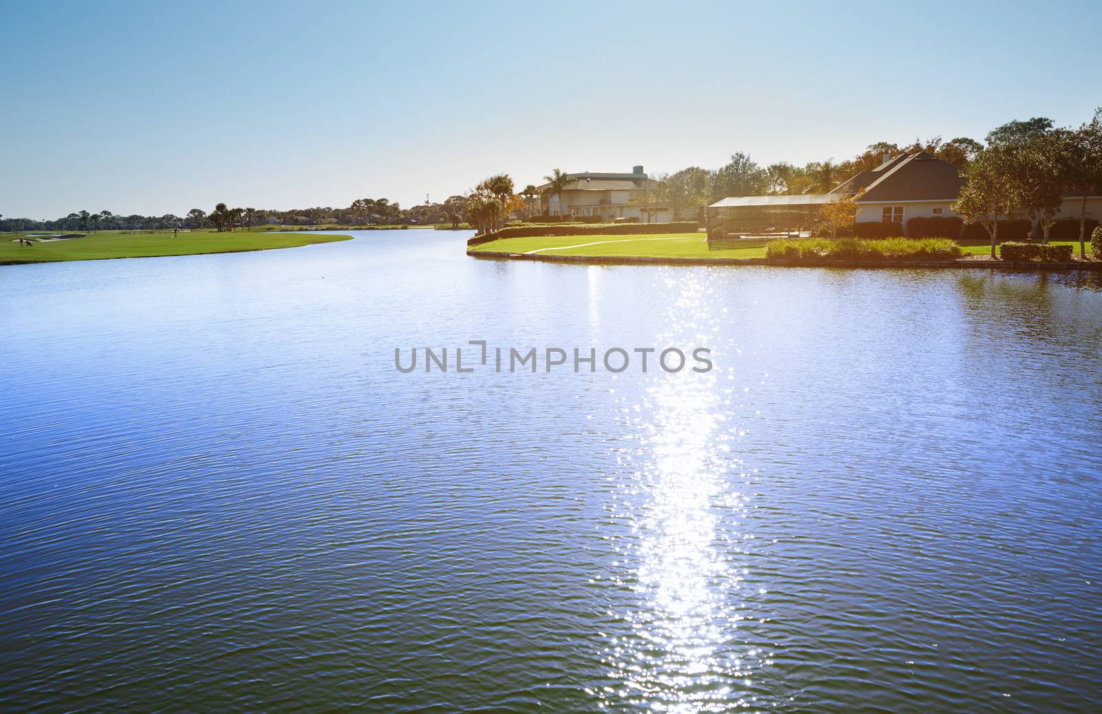 View on suburb district with pond and palm trees. Florida, USA