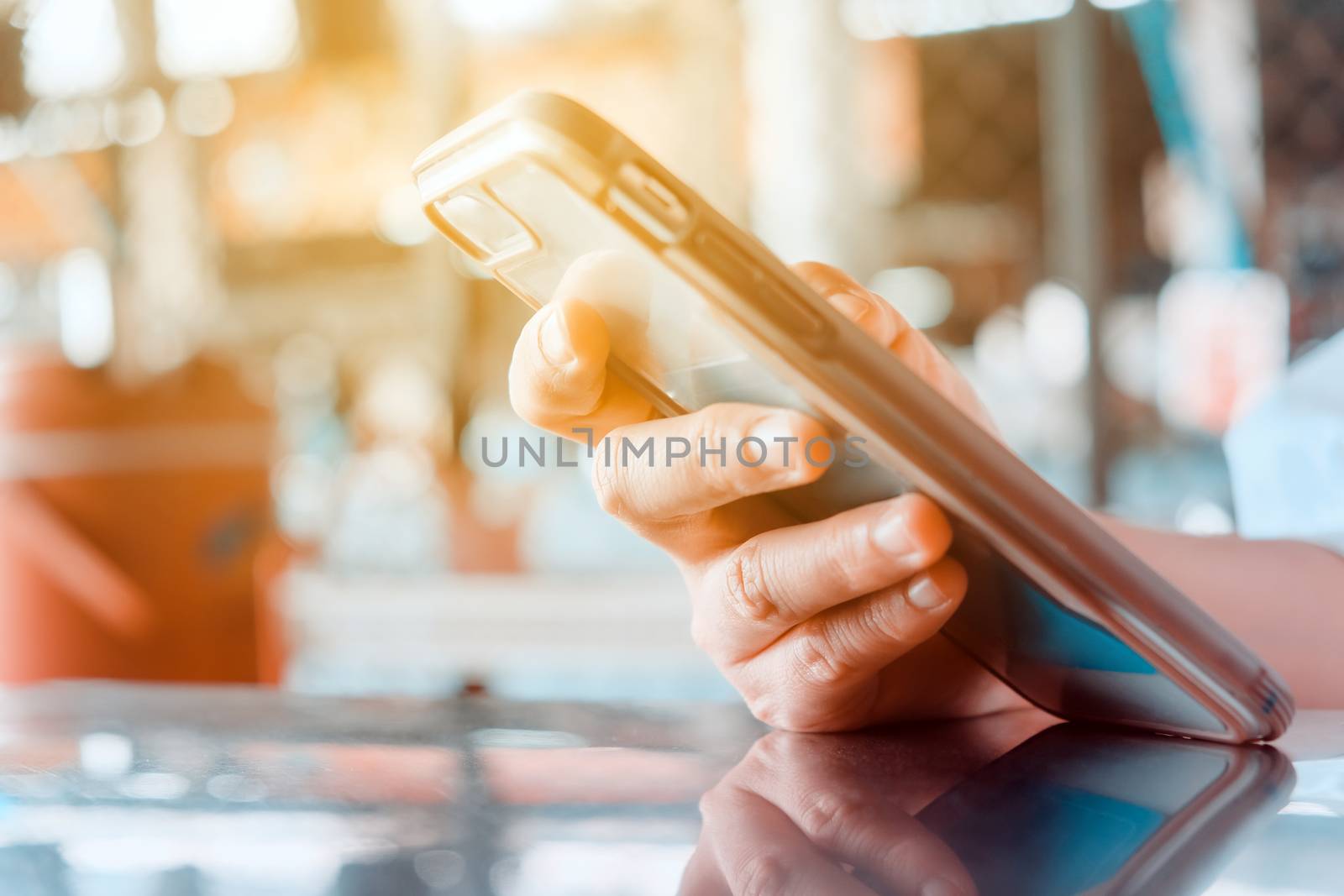 Closeup Image of Women Hand holding a smartphone