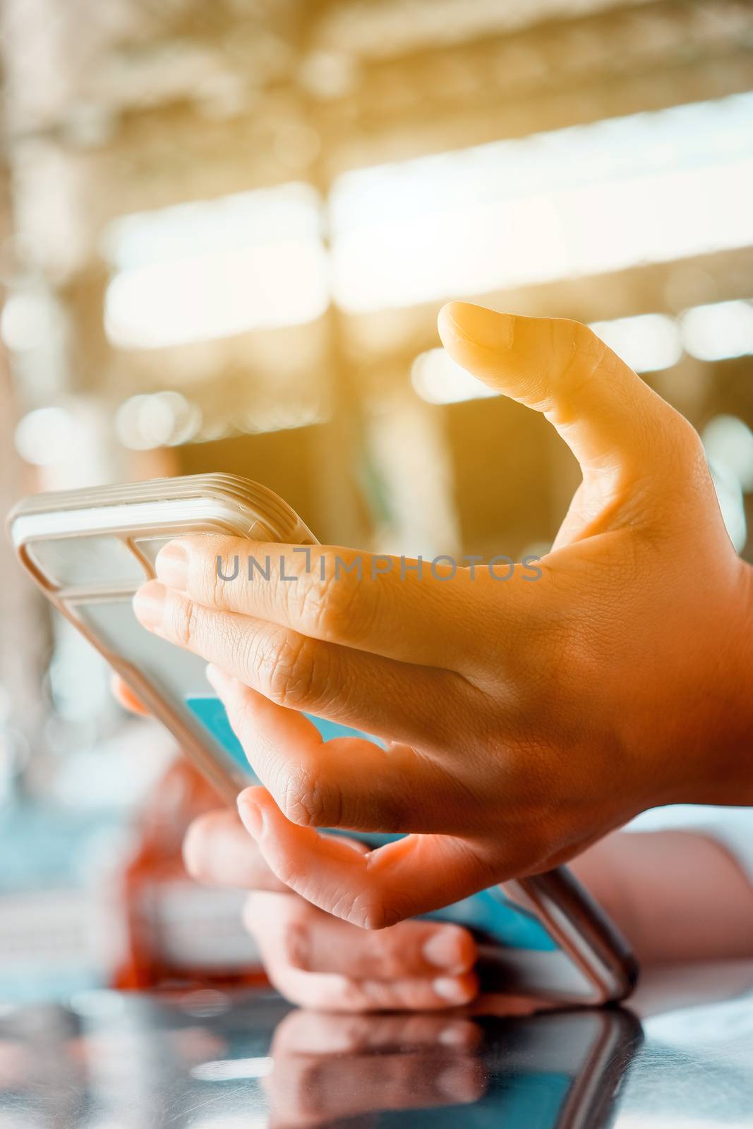 Closeup Image of Women Hand holding a smartphone by ponsulak