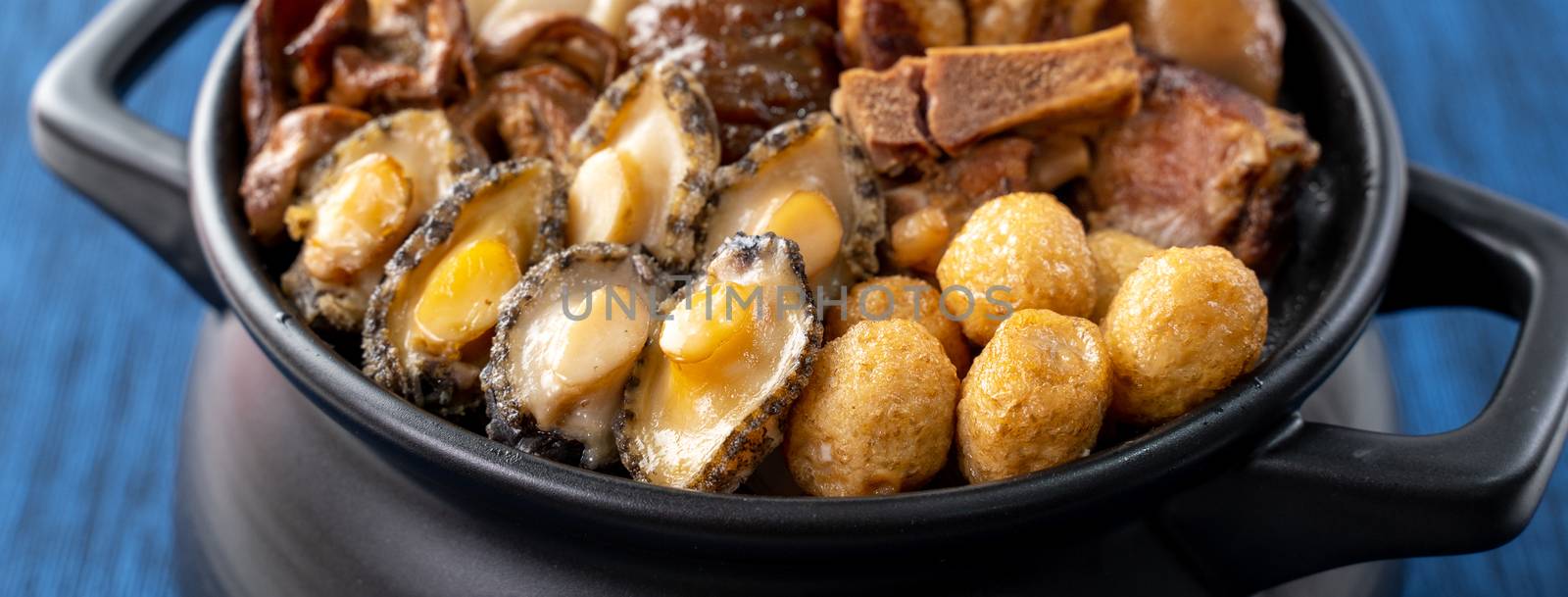 Traditional food of Chinese lunar new year, Buddha jumps over the wall, Chinese Soup Casserole dish, Buddha's Temptation, named Fo Tiao Qiang, close up.