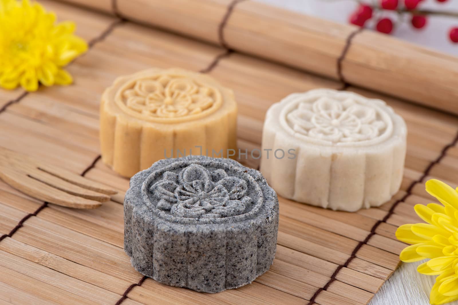 Colorful beautiful moon cake, mung bean cake, Champion Scholar Pastry cake for Mid-Autumn festival traditional gourmet dessert snack, close up.