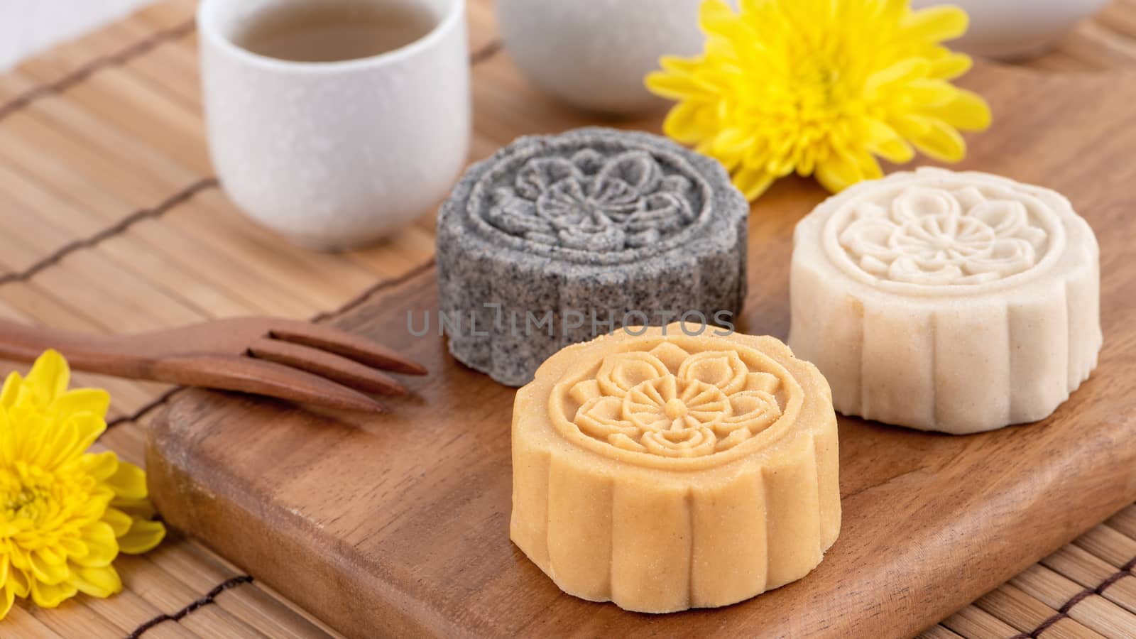 Colorful beautiful moon cake, mung bean cake, Champion Scholar Pastry cake for Mid-Autumn festival traditional gourmet dessert snack, close up.