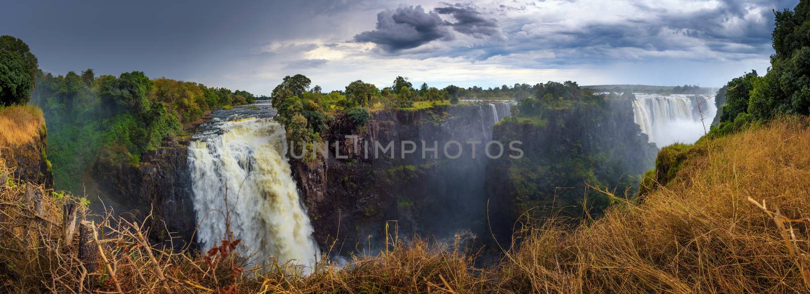 Panorama of Victoria Falls on Zambezi River in Zimbabwe by nickfox