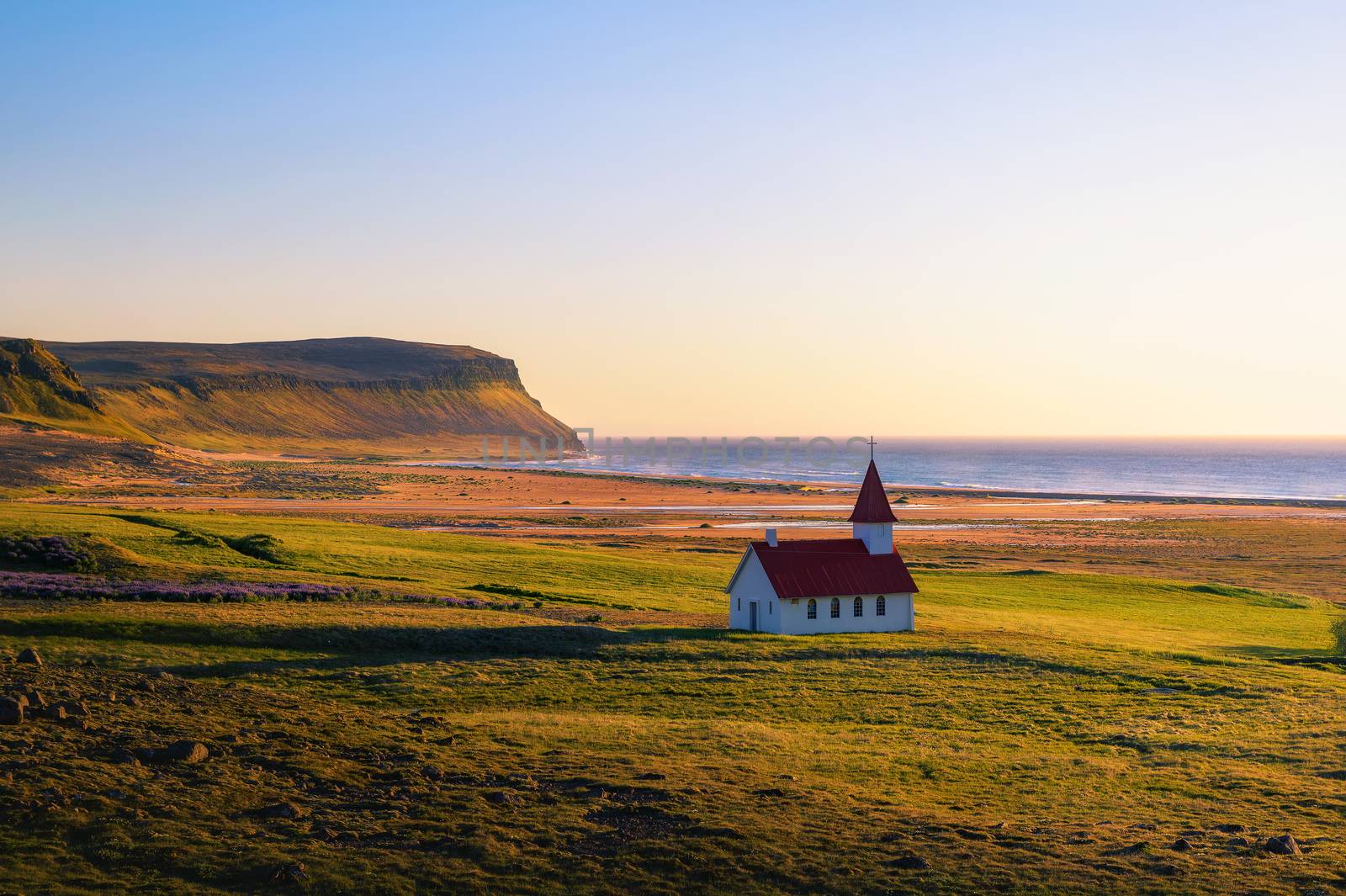 Sunset at the Breidavik church in Westfjords, Iceland by nickfox