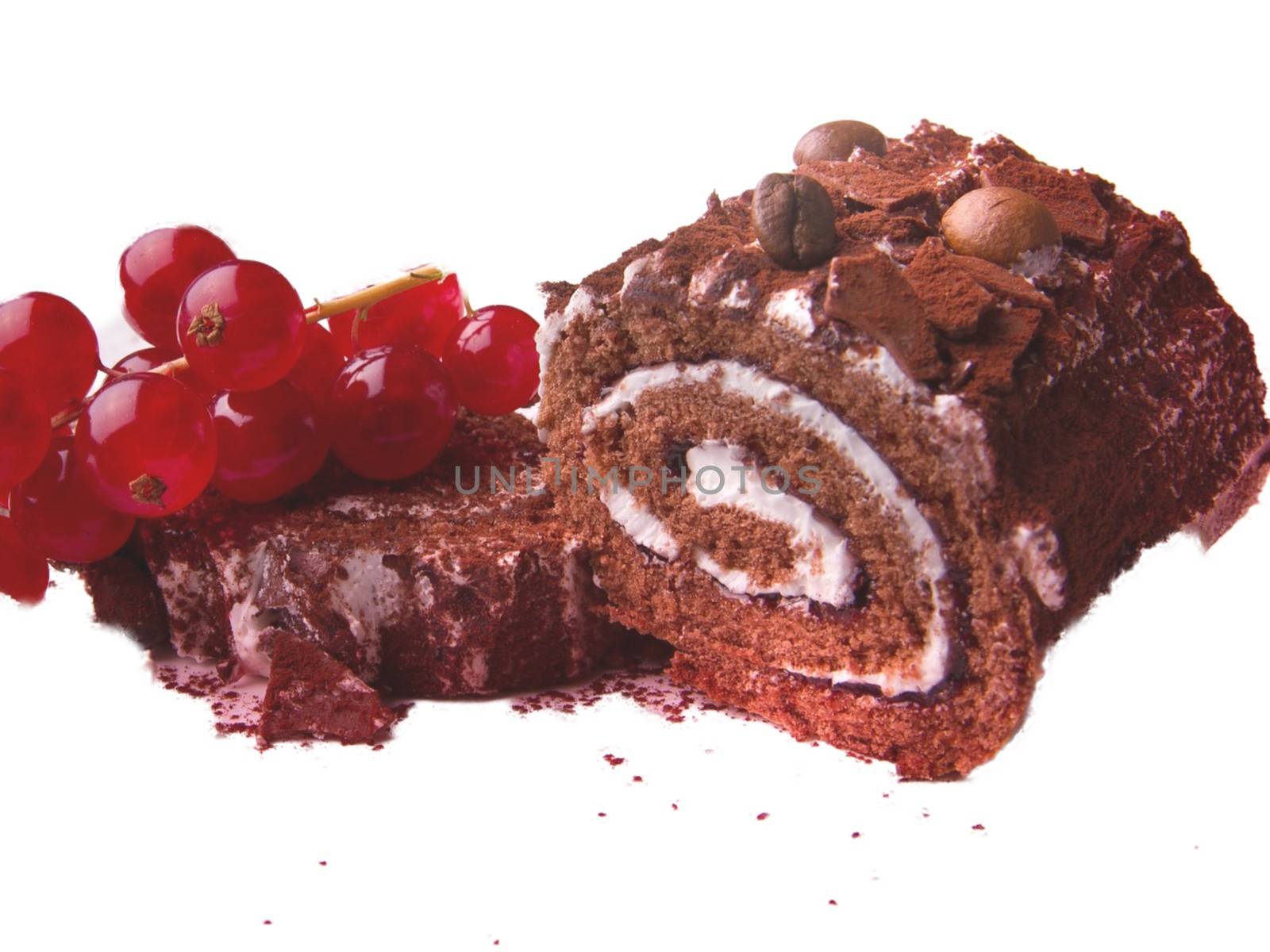 Closeup of a coffee cake roll topped with a bunch of grapes isolated on white background.