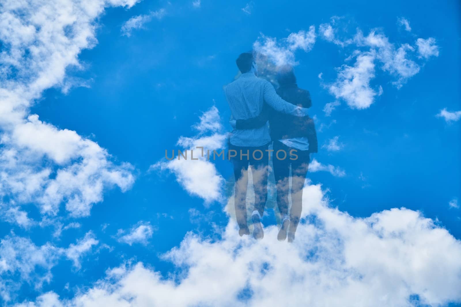 Couple walks to the heavens through the clouds High quality photo