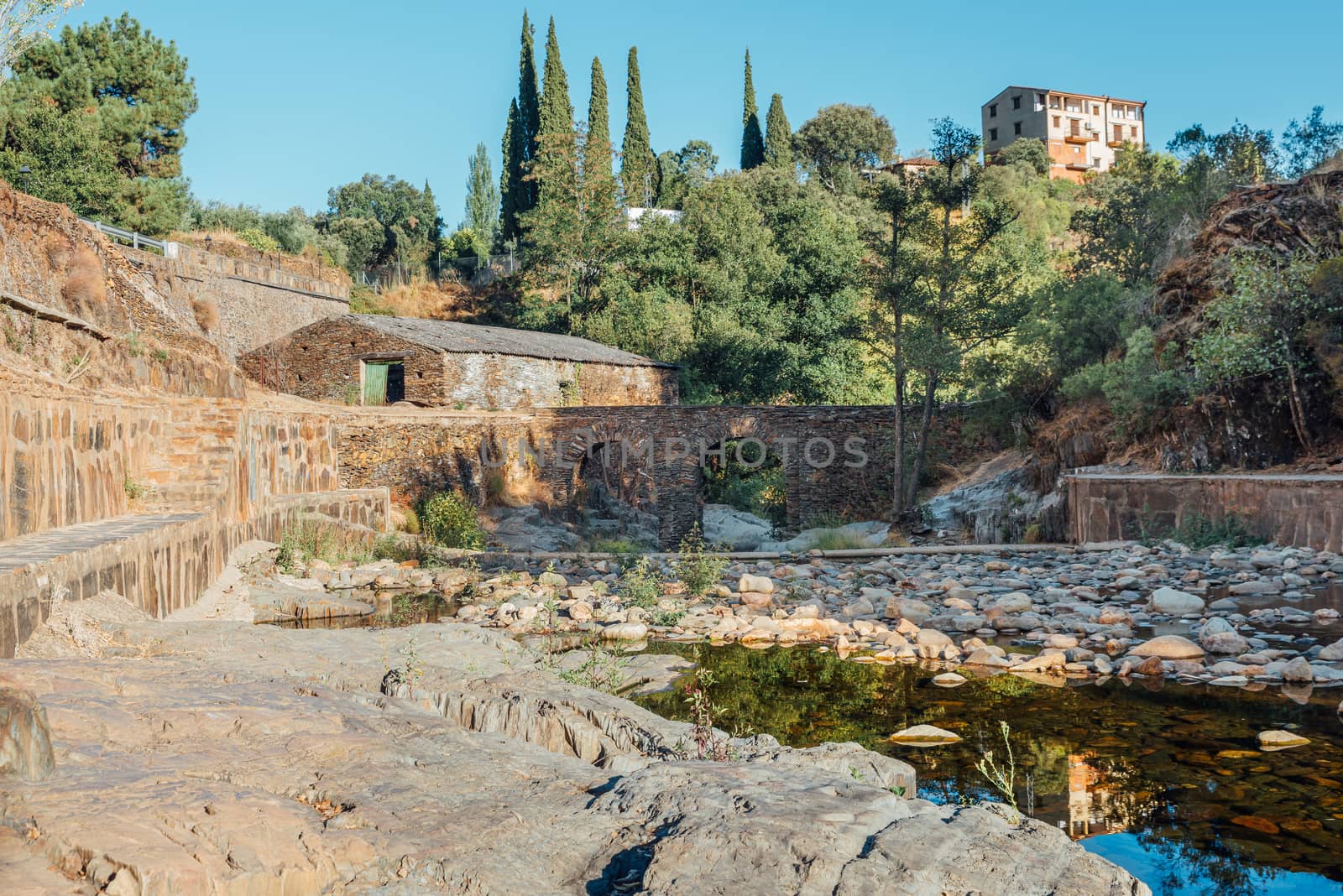 Roman bridge and natural pool in Las Mestas, Caceres, Extremadura, Spain