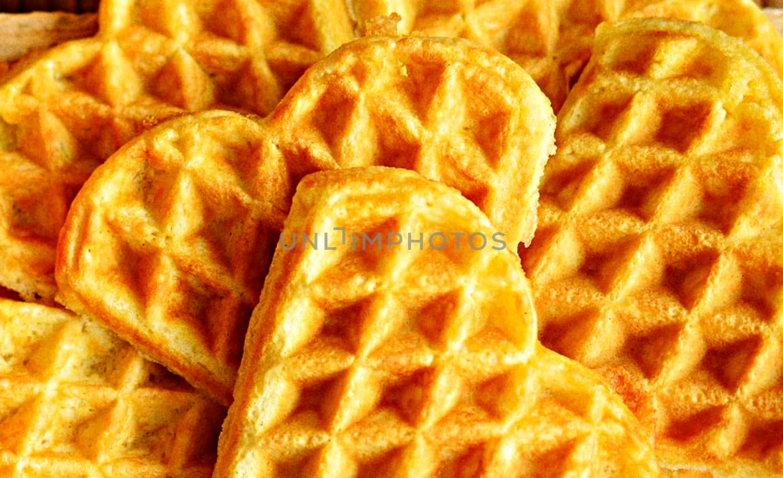 Closeup shot of delicious heart-shaped waffles.
