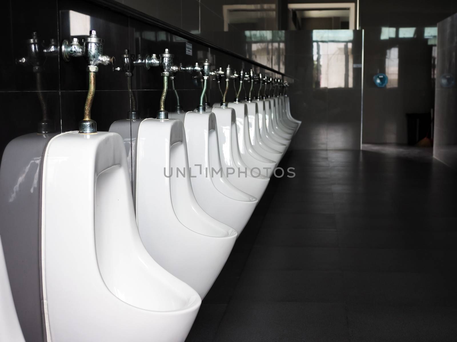Urinal in public toilets by Unimages2527