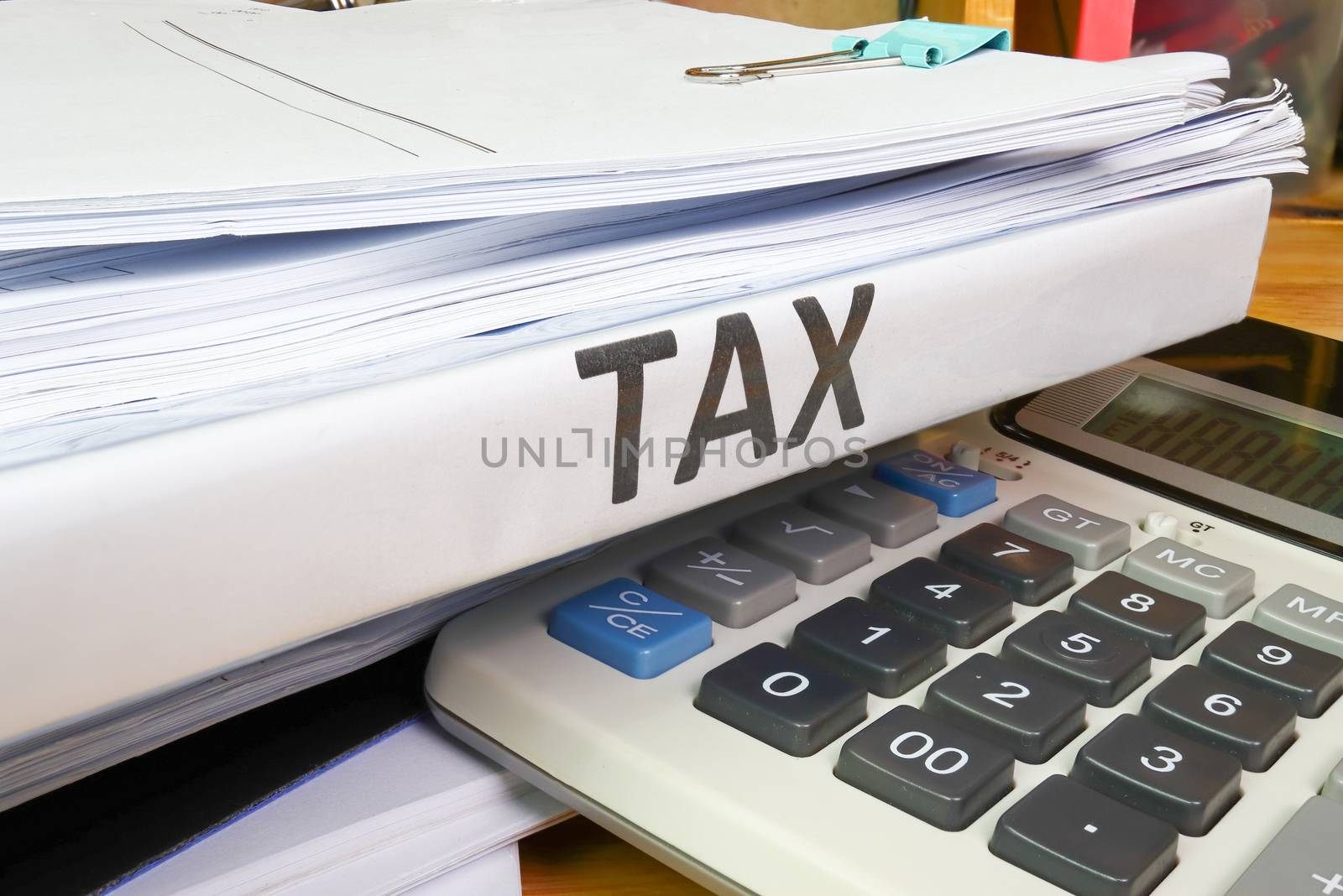 Folder Tax documents and paper files with calculator concept Annual tax payment