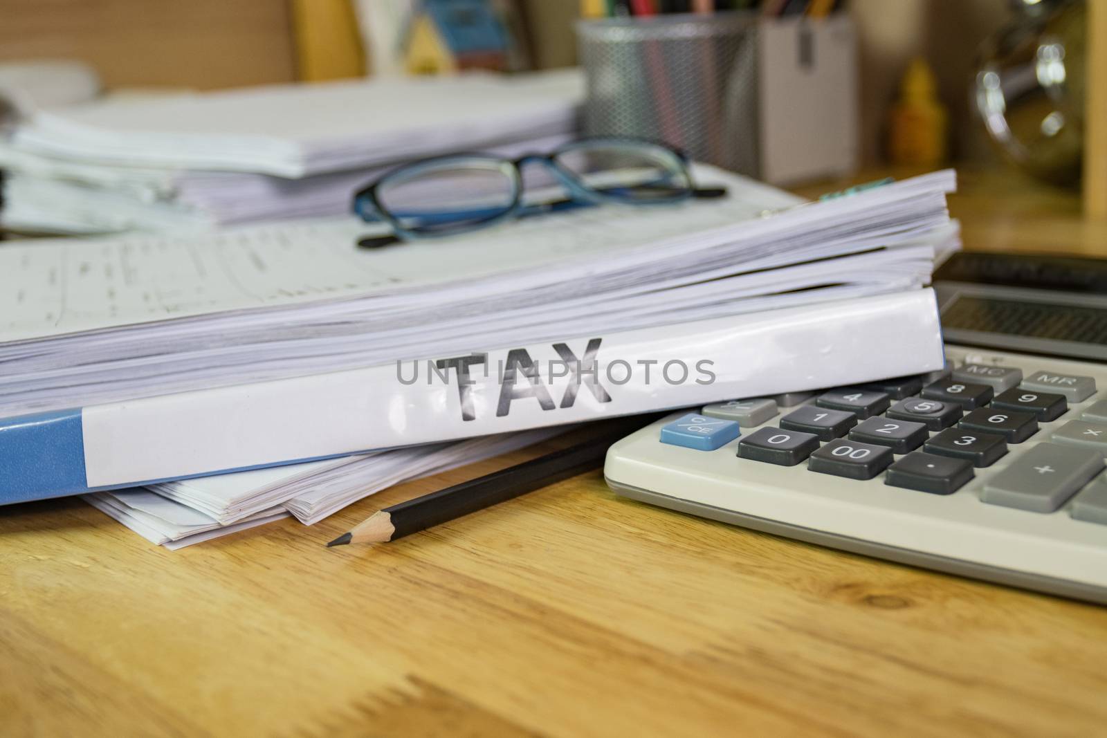 Folder Tax documents and paper files with calculator concept Annual tax payment