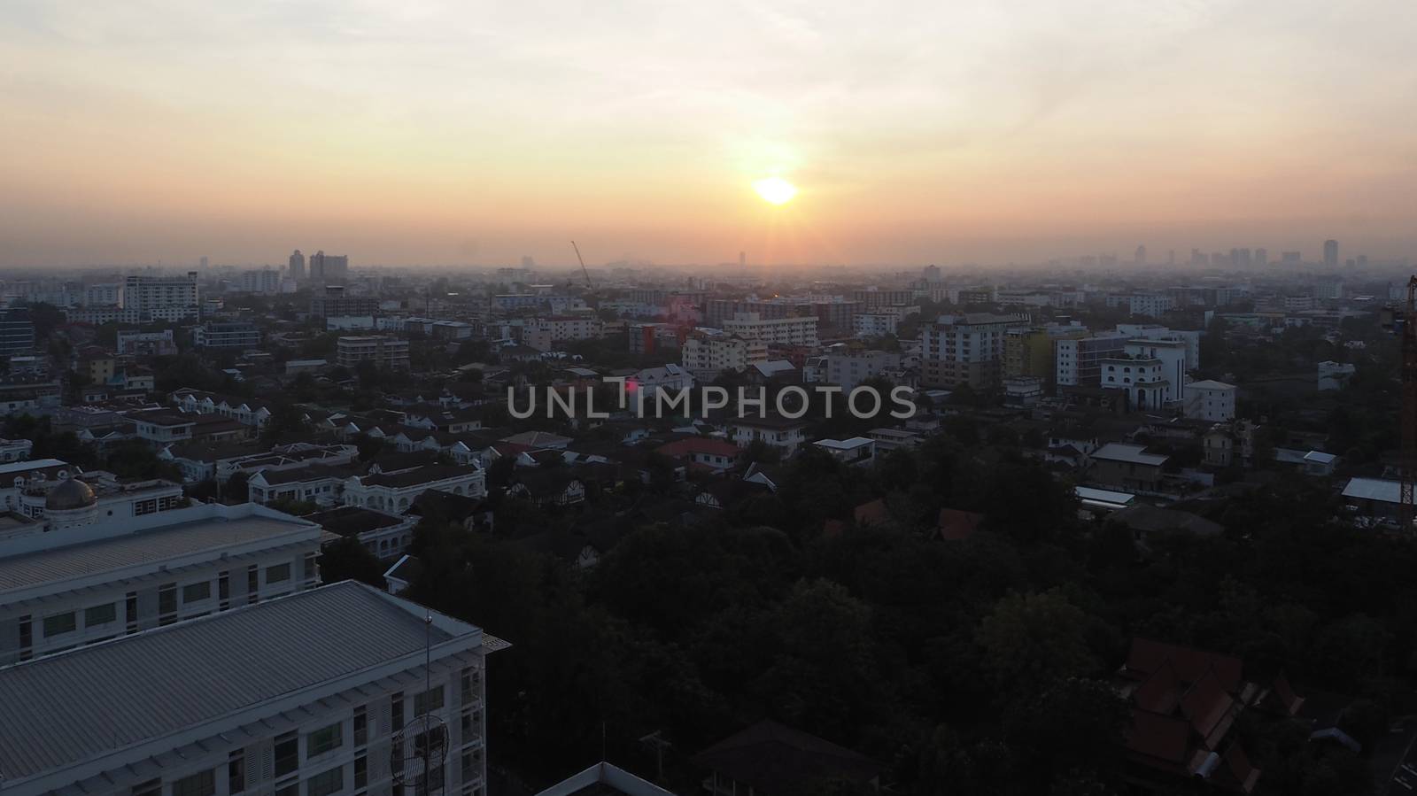 Sun rise on the sky and Bangkok urban city landscape in the morning.