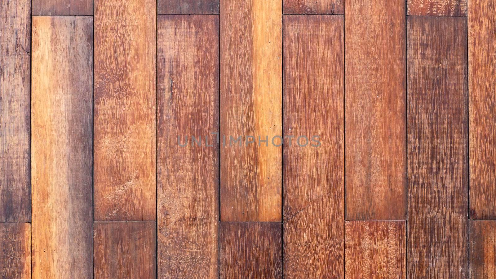 Old real natural wood texture surface of floor and dark brown color.