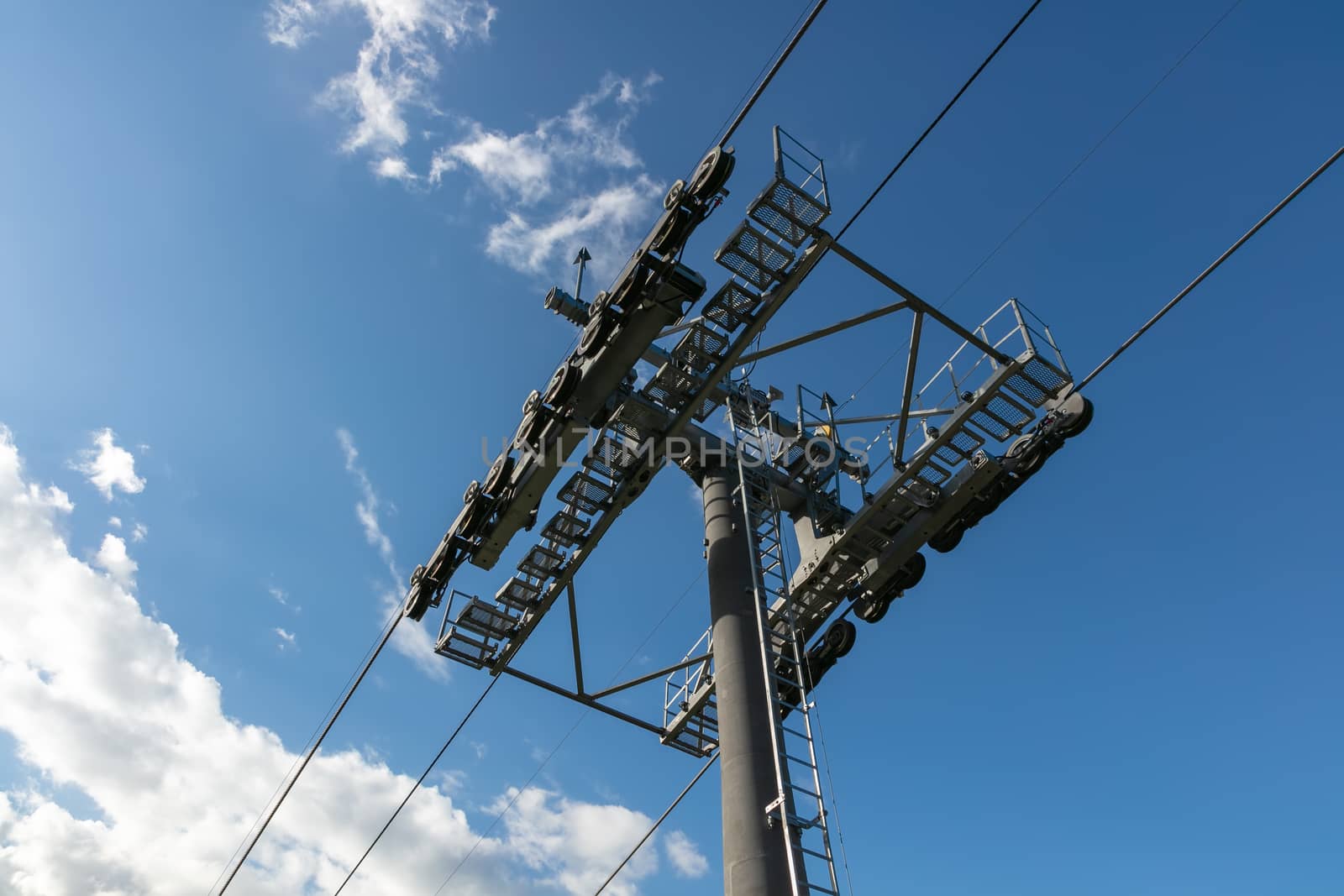 Low angle shot of cableway on a blue sky background