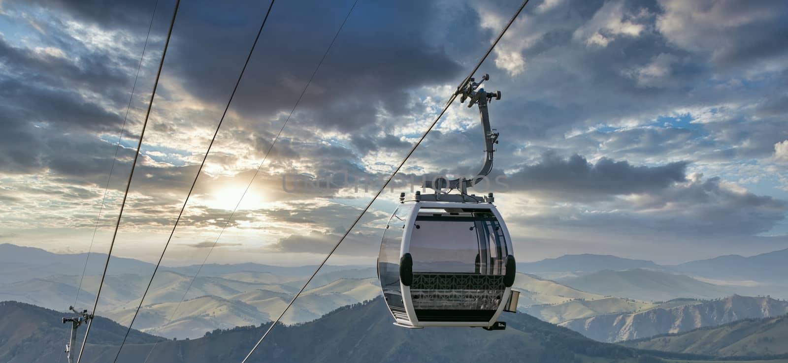 Shot of cableway. Beautiful sunset sky background by DamantisZ