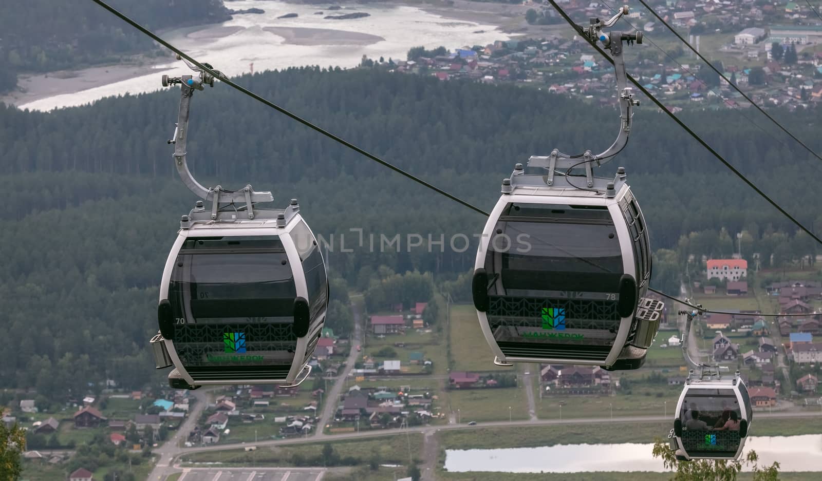 High angle shot of cableway on cityscape backdrop by DamantisZ