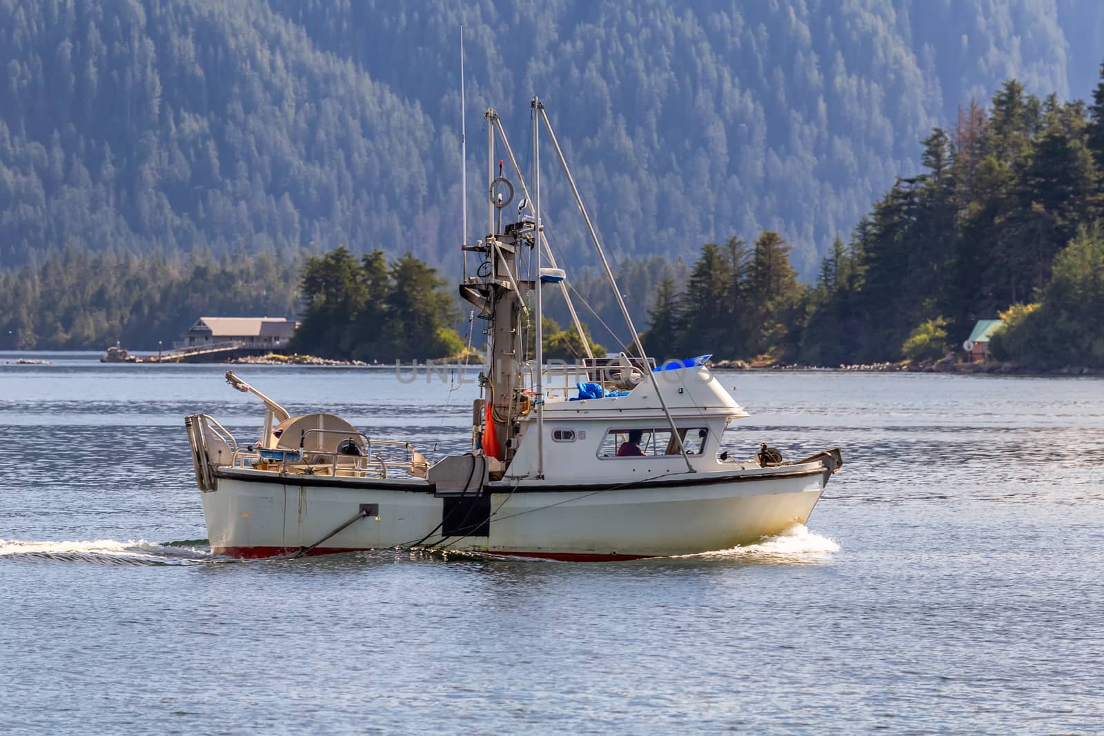 Commercial fishing boat sailing in Sitka, Alaska by DamantisZ