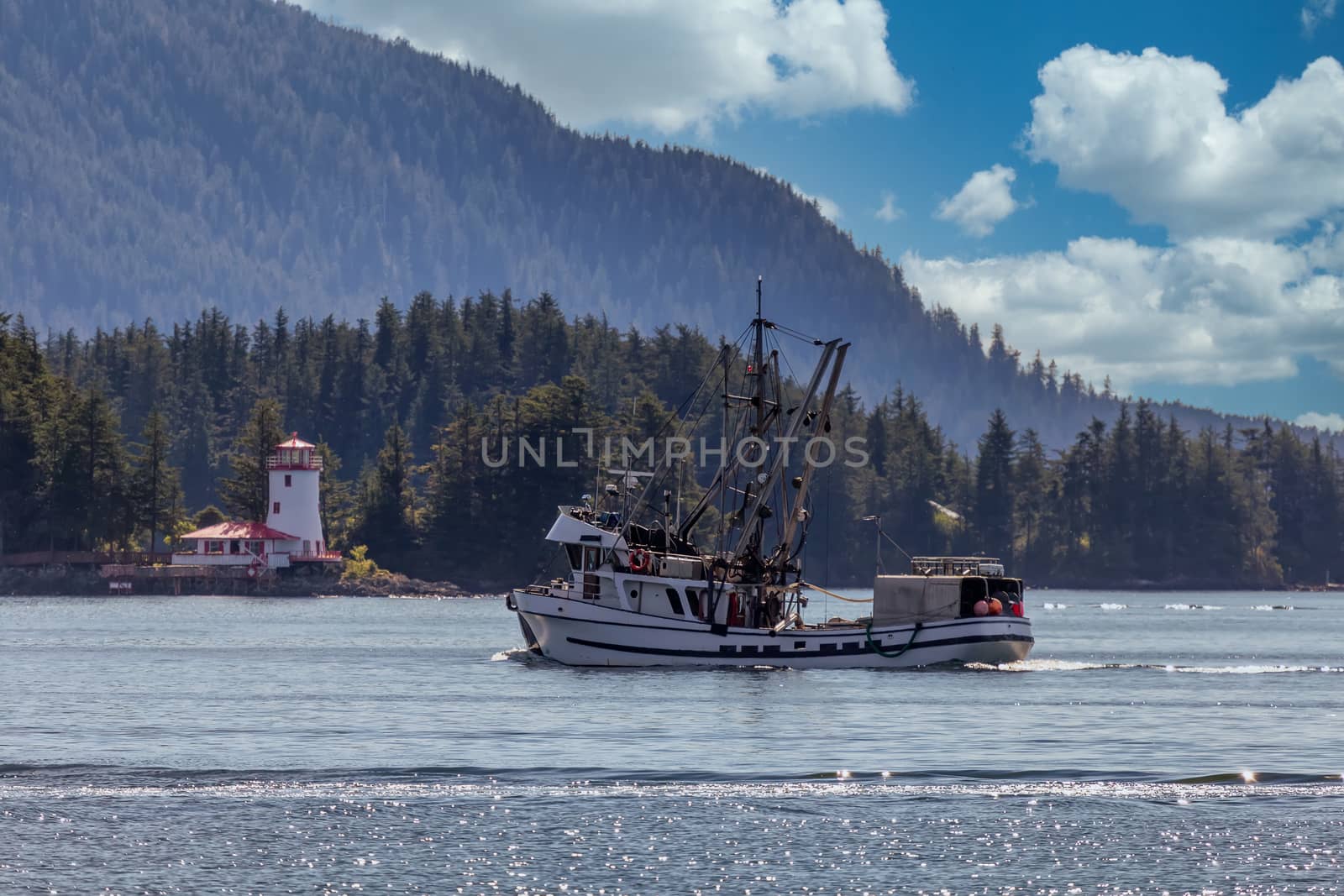 Commercial fishing boat sailing in Sitka, Alaska by DamantisZ