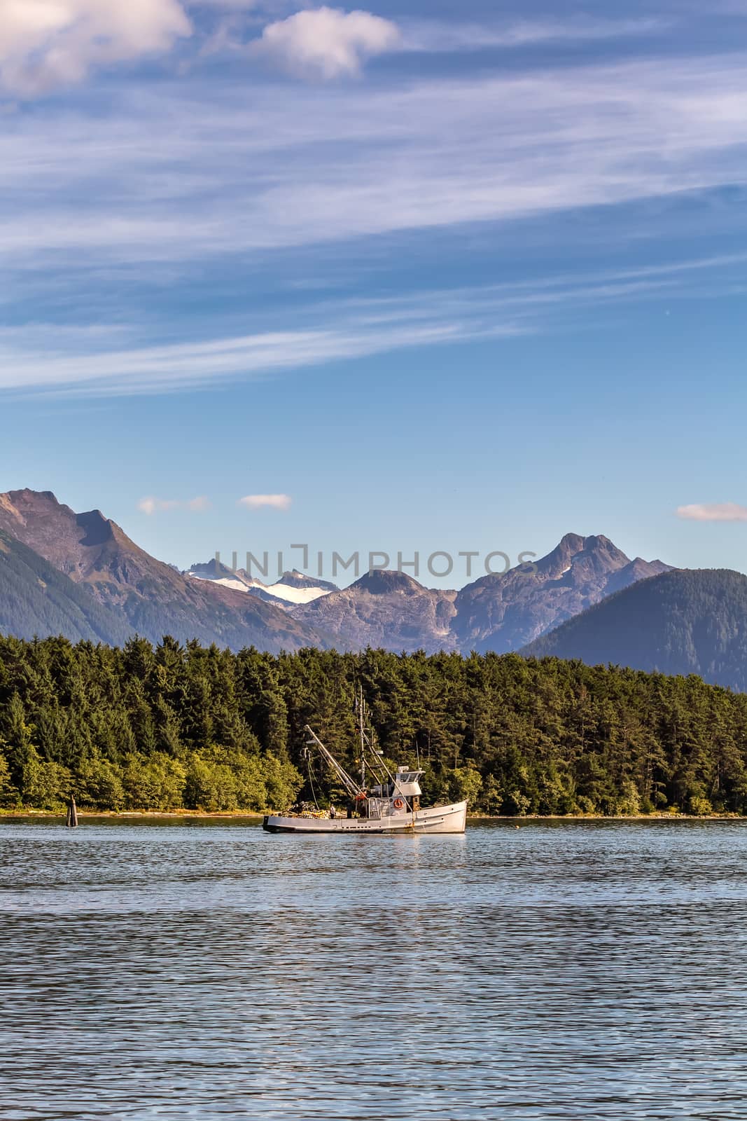 Shot of fishing boat anchored in harbour in Sitka by DamantisZ