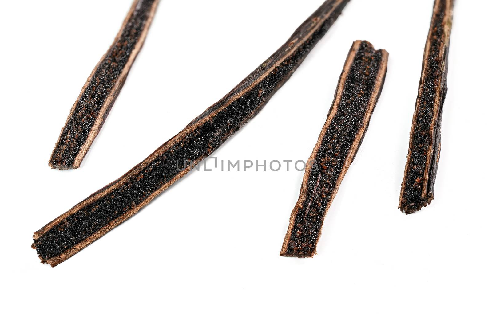 Vanilla pods cut with knife, black seeds visible, closeup macro detail photo isolated on white background.